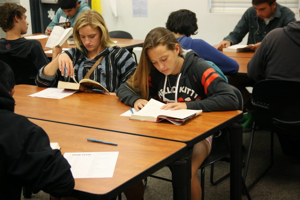 Freshmen Lezly Plahn (left) and Brianna Graham (right) begin to read their books for the "Angel Potato Revolution." Credit: Megan Kearney/The Foothill Dragon Press