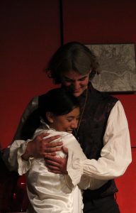 Chris Clark '17 and Cayla Clark '18 'embrace' their roles onstage. Credit: Carrie Coonan / The Foothill Dragon Press