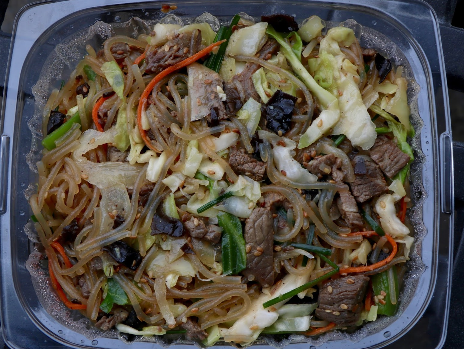 Japchae is a dish composed of cellophane noodles with a soy sauce and sesame oil sauce. Credit: Abigail Massar / The Foothill Dragon Press