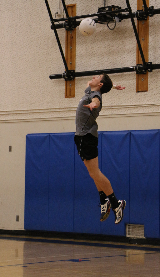 Dylan More '18 takes a float serve. Credit: Jason Messner / The Foothill Dragon Press