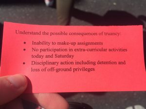 A picture of the red slip that was being handed out to students. Credit: Jocelyn Brossia / The Foothill Dragon Press