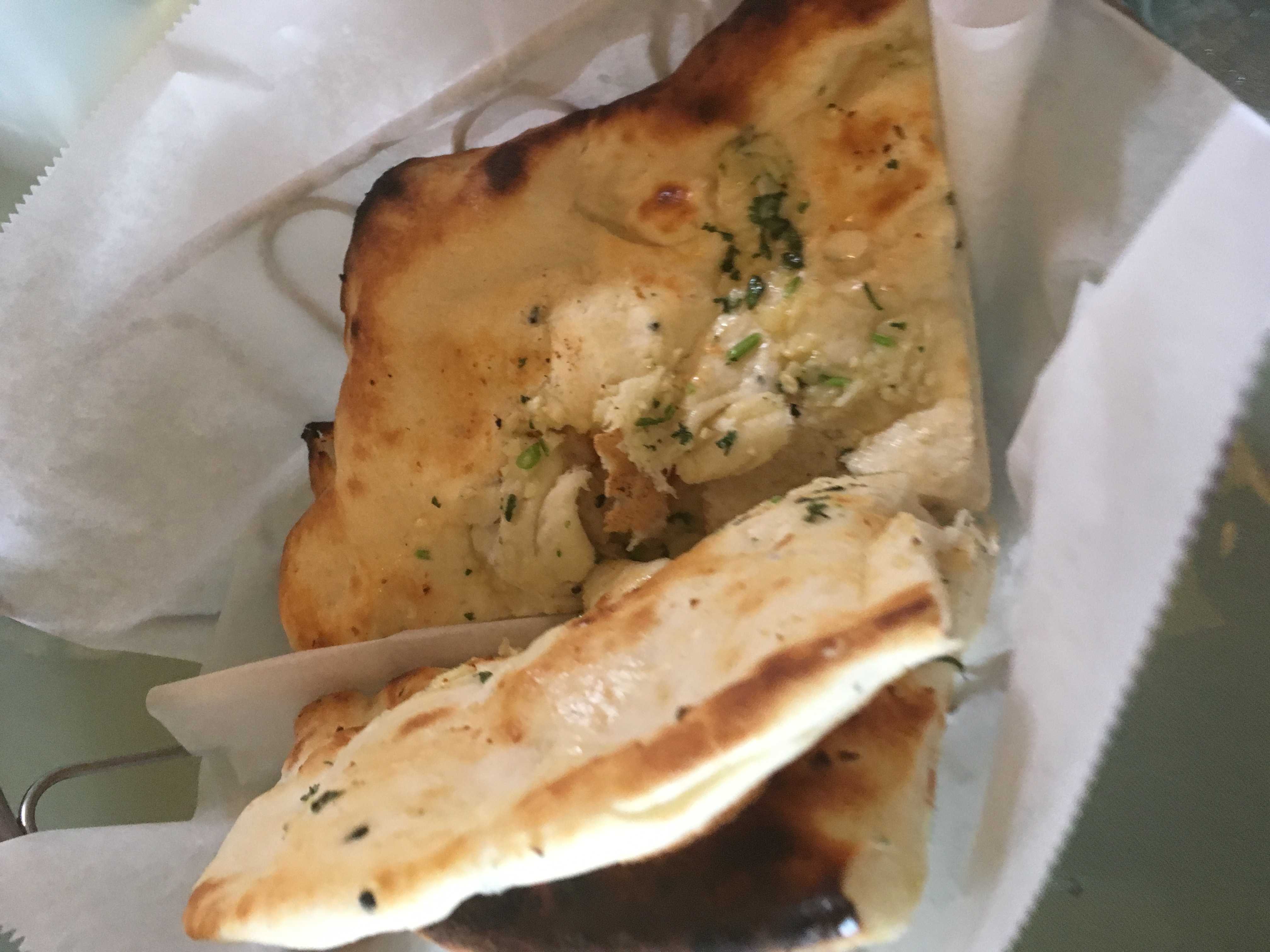 A savory and delicious basket of garlic naan bread from The Taj Cafe. Credit: Elie Bufford / The Foothill Dragon Press