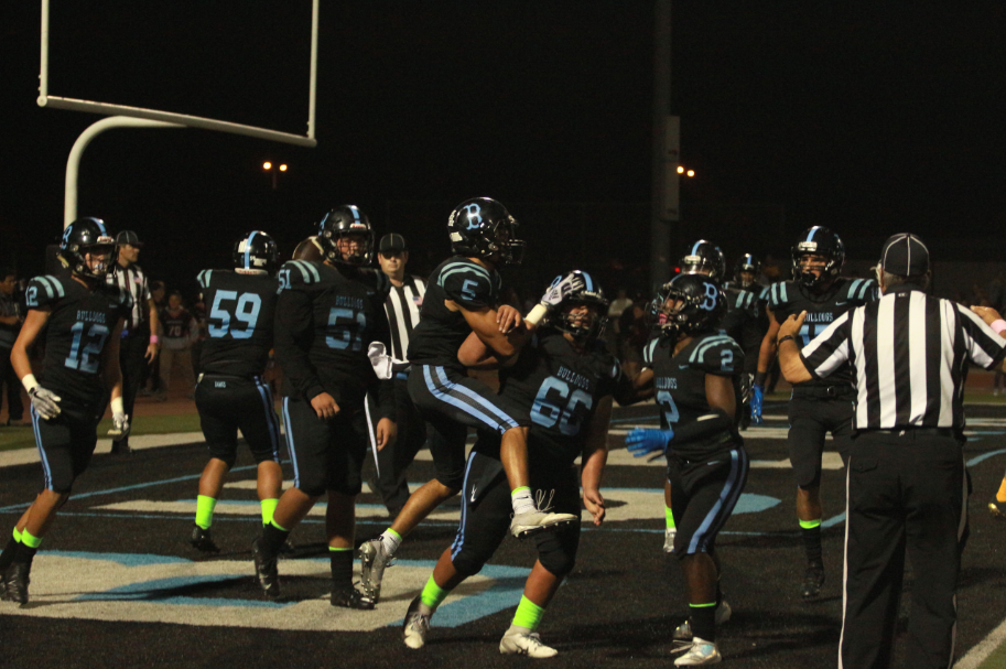 The Bulldogs celebrate after scoring their first touchdown of the game. Credit: Jason Messner / The Foothill Dragon Press