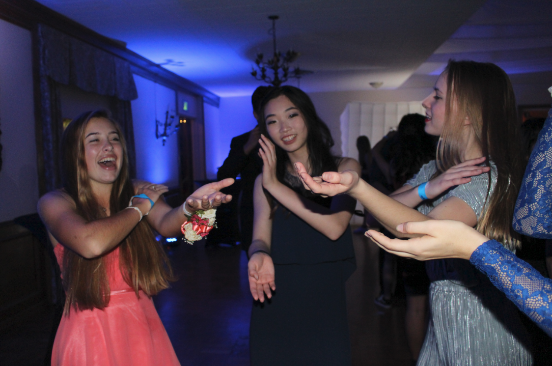 Hannah Hart ‘20, Michelle Kim ‘20 and Magnolia Fife ‘20 do the Macarena to a song which is most definitely not La Macarena. Credit: Maya Avelar / The Foothill Dragon Press