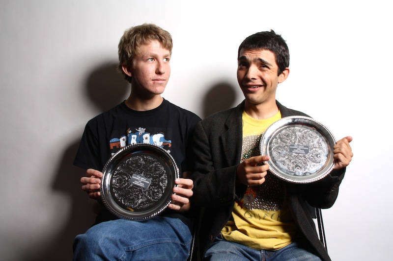 Seniors Aron Egelko and Kevin Kunes show off the quarterfinal plates that they earned last weekend at UC Berkeley's high school debate tournament. Credit: Aysen Tan/The Foothill Dragon Press.