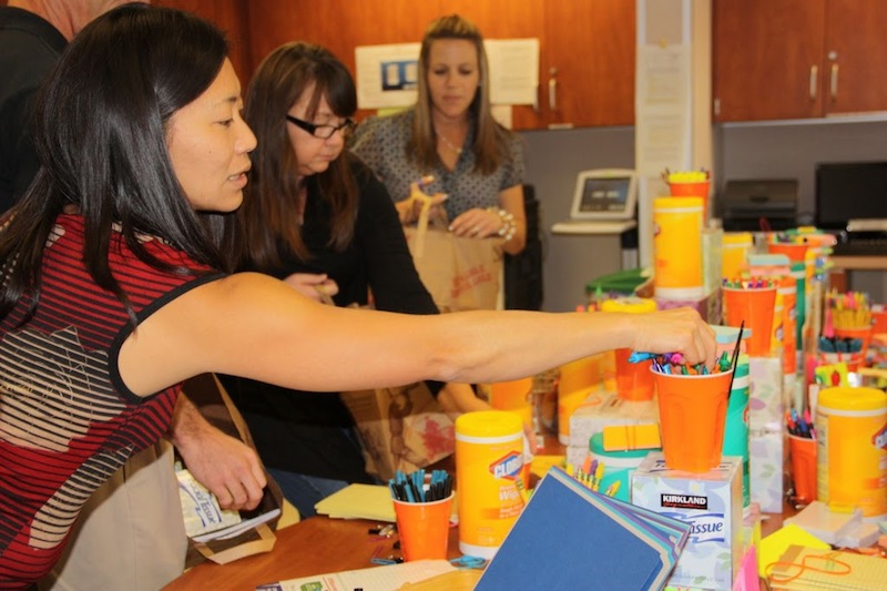 Science teacher Mika Anderson reaches for supplies at the annual "Teacher Tower." Credit: Bridget Parrino/The Foothill Dragon Press