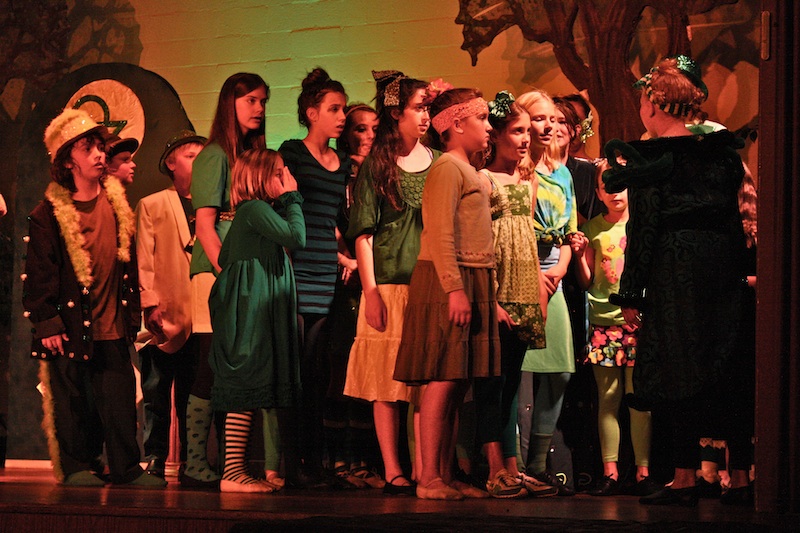Young artists perform as the citizens of the Emerald City in PTYA's production of "Wizard of Oz." Credit: Caitlin Trude/The Foothill Dragon Press.