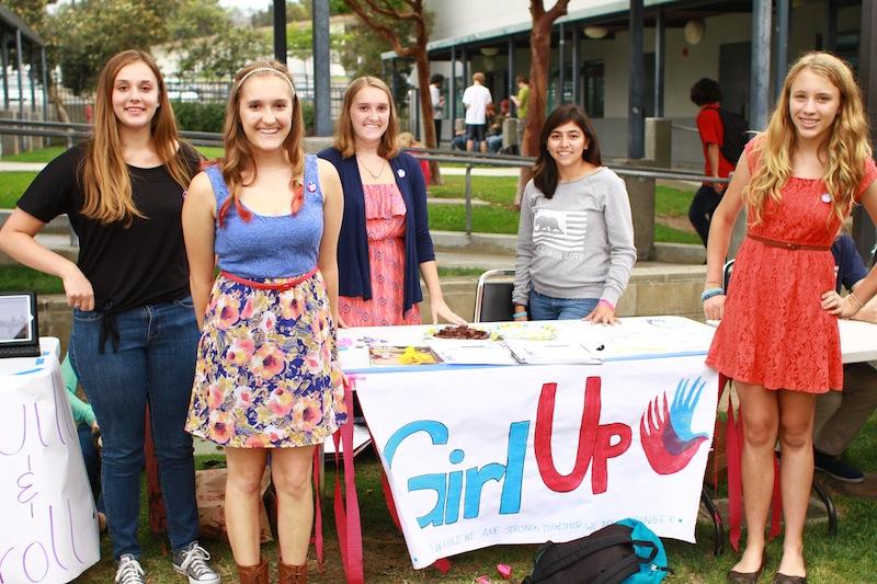 (From left) Sophomores Tess McLaughlin, Kailey Schuyler, Meghan Schuyler, Ashley Quezada, and Fidelity Ballmer stand by the Girl Up table at Club Rush. Credit: Aysen Tan/The Foothill Dragon Press