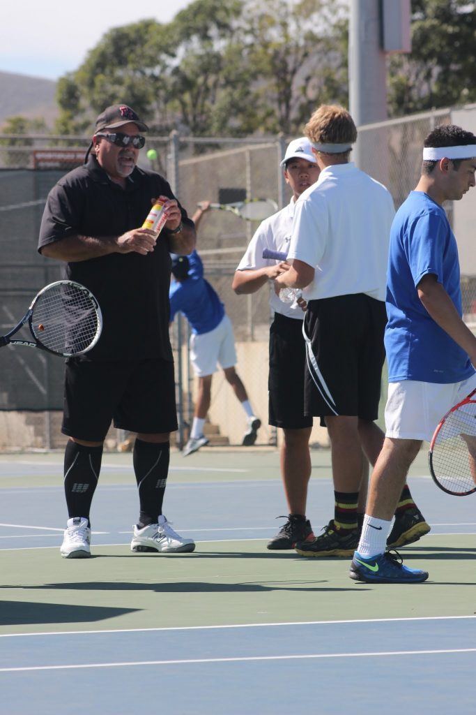 Senior Josh Ren and Sophomore Noah Colby talk to Coach Brad McClain. Credit: Rachel Horiuchi/The Foothill Dragon Press