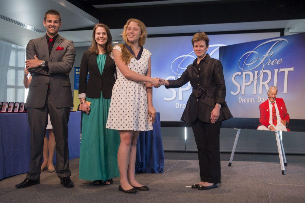 The Neuharth family and Fidelity during the Free Spirit graduation ceremony. Photo courtesy of the Newseum.