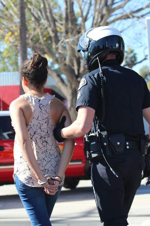 Junior Rhiannon Tircuit portrayed the drunk driver that was arrested and taken off of campus during Monday's Every Fifteen Minutes simulation. Credit: Carrie Coonan/The Foothill Dragon Press