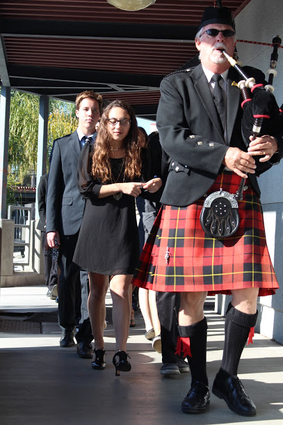 The funeral procession was led by a bagpipist and had the "living dead" students, as well as actors, walking two by two. Credit: Jessie Snyder/The Foothill Dragon Press