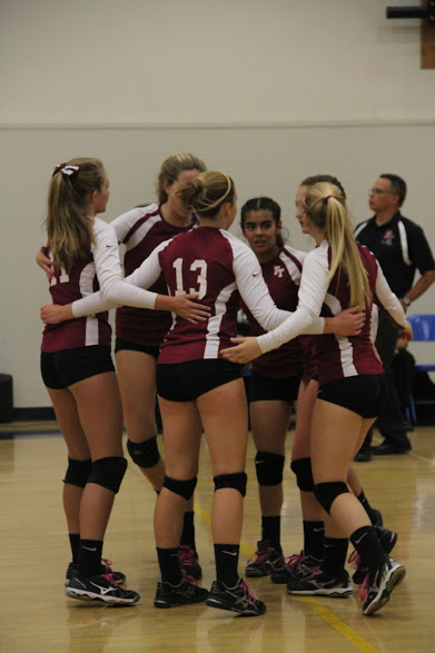 The players meet during Tuesday's game to pump each other up. Credit: Claire Dinkler/The Foothill Dragon Press