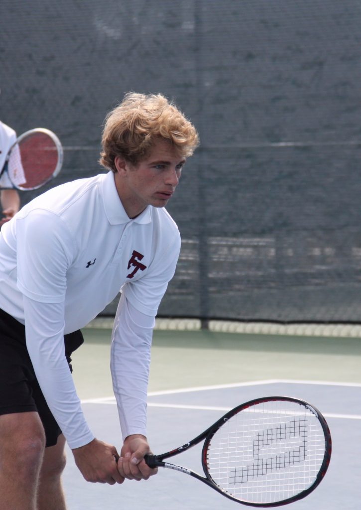 Junior Noah Colby await the start of their doubles match. Photo Credit: Gabrialla Cockerell / The Foothill Dragon Press 