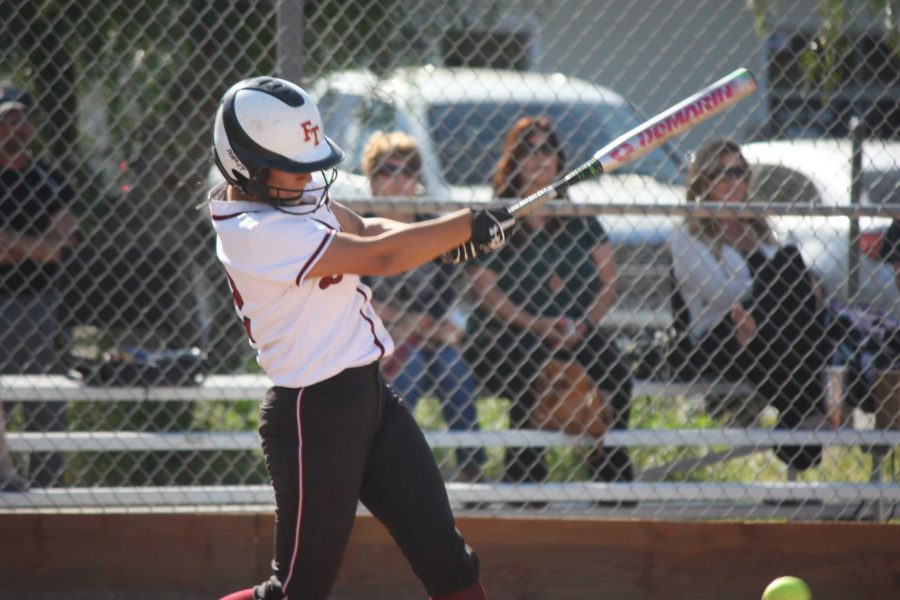 Junior Taylor Wreesman (12), with a stroke of her bat, gets ready to sprint to first base. 
Credit: Gabrialla Cockerell/ The Foothill Dragon Press