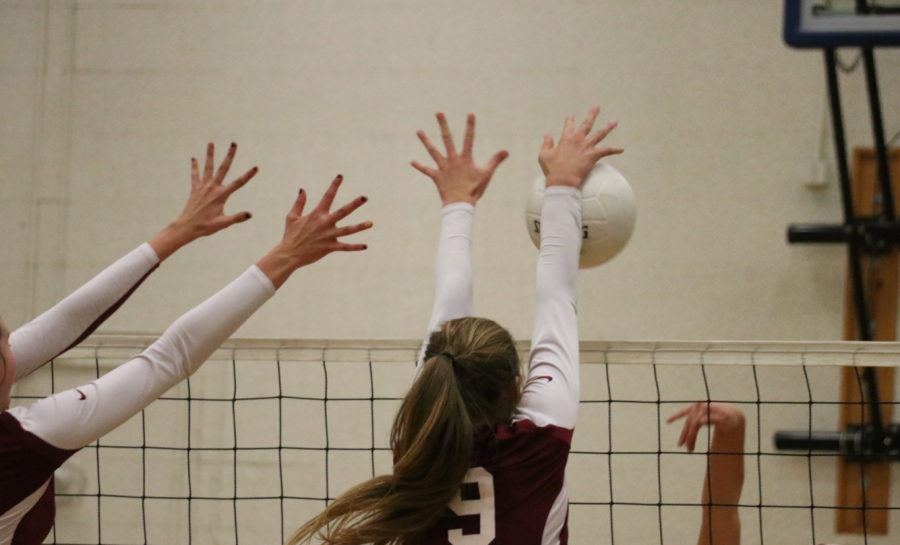 Morgan Gallagher 18 has both hands up to block opponent. Credit: Olivia Sanford / The Foothill Dragon Press