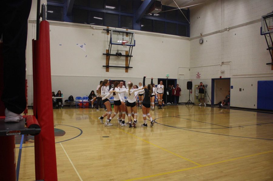 Girls varsity cheers together after winning their CIF playoff game. Credit: Gabrialla Cockerell / The Foothill Dragon Press