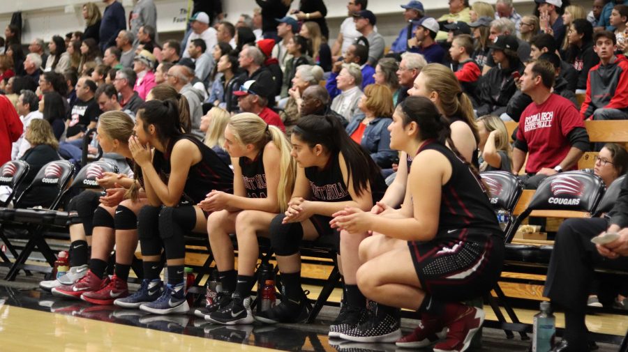 The girls watch their teammates from the sidelines. Credit: Riyanna De La Rosa(used with permission)
