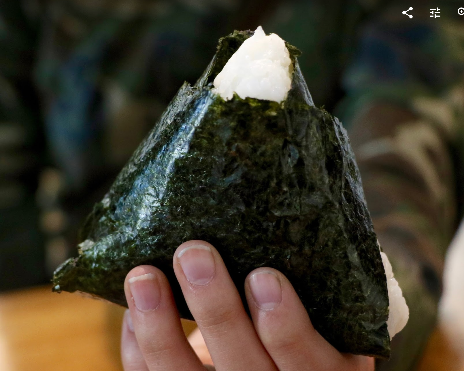 Onigiri is a triangular shaped rice ball wrapped in seaweed. Credit: Abigail Massar / The Foothill Dragon Press