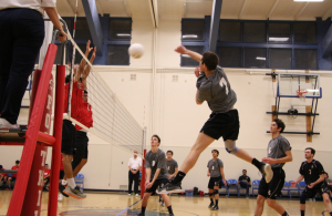 Collin Weaver 18 swings across the net hoping for a kill. Credit: Jason Messner / The Foothill Dragon Press