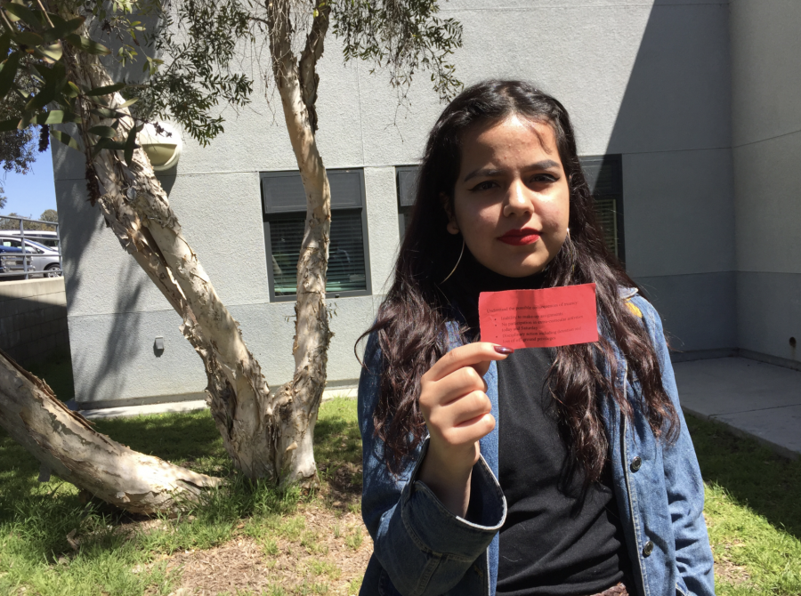 Annie Castañeda 18 holds up the red slip that she received from administration. Credit: Sam Bova / The Foothill Dragon Press
