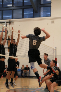 Matt Godfrey '20 jumps and prepares to swing. Credit: Jason Messner / The Foothill Dragon Press