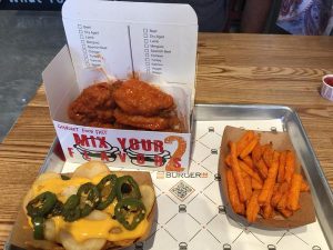 Chicken wings, Sweet Potato Fries and BurgerIM Fries with jalapeños and cheese. Credit: Sophia Parker / The Foothill Dragon Press