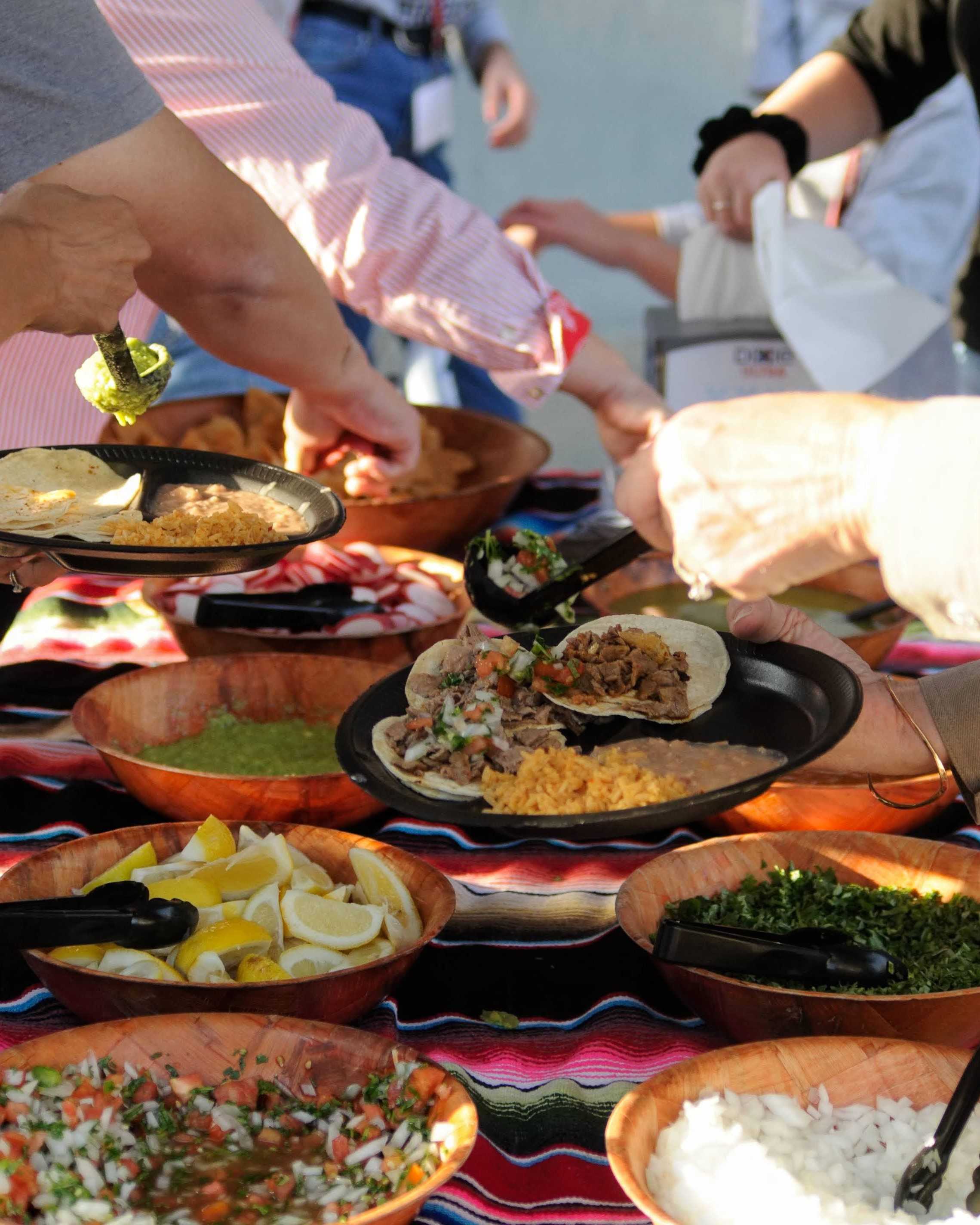 Parents fill up their plates. Credit: Muriel Rowley / The Foothill Dragon Press