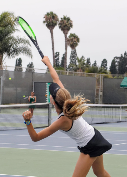 Noelle Hayward '21 hits back an oncoming ball to the opponent Credit: Muriel Rowley / The Foothill Dragon Press