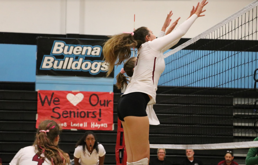 Lexi Malone '19 in action to block the opposing team. Credit: Olivia Sanford / The Foothill Dragon Press