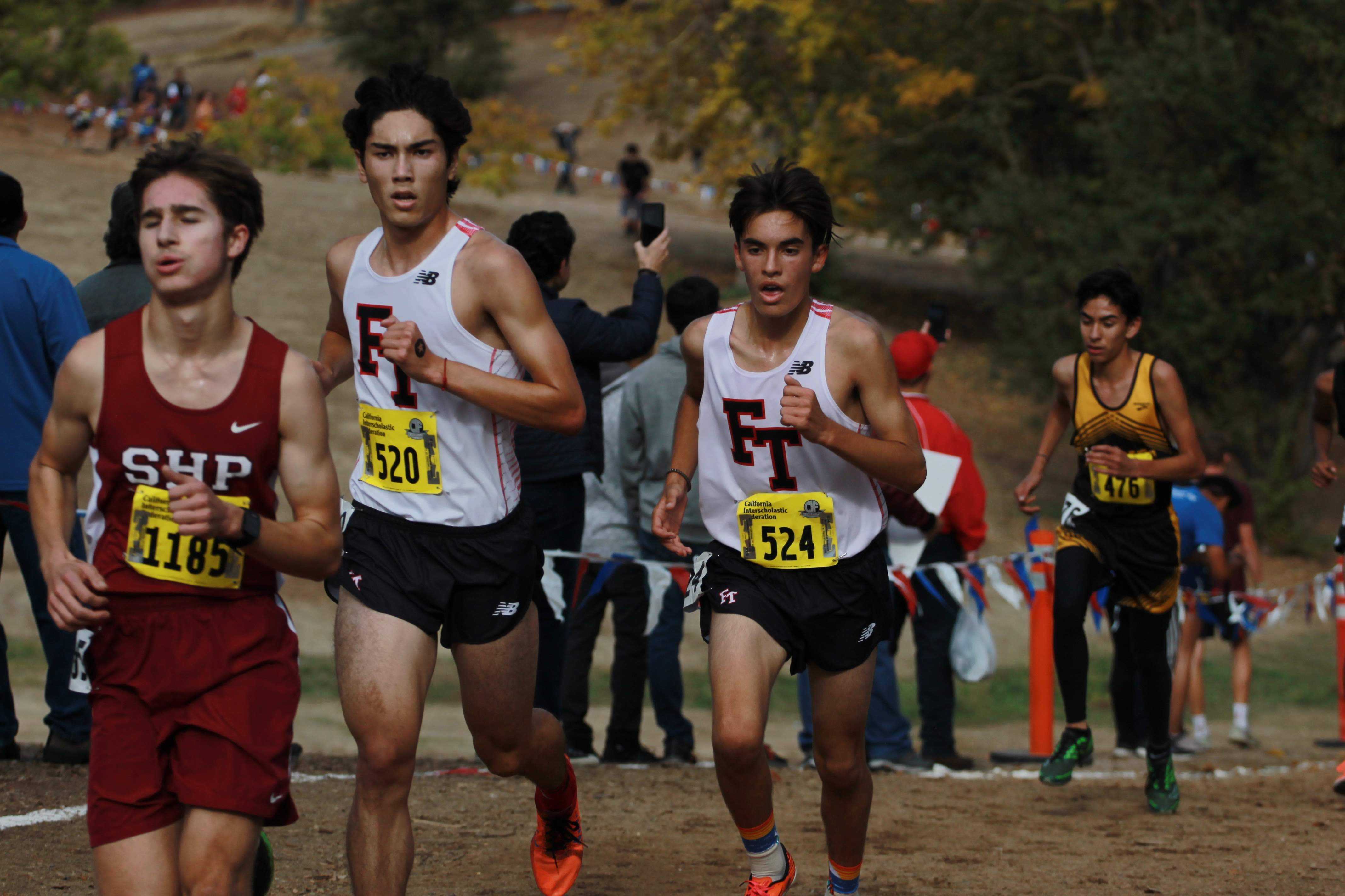 Jason Messner and Joshua Villasenor work up the hill at the two-mile marker. Credit: Jocelyn Brossia / The Foothill Dragon Press