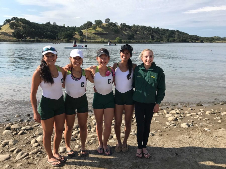 Mia Monsour '21 smiles with her teammates after a race. Credit: Dani Thole