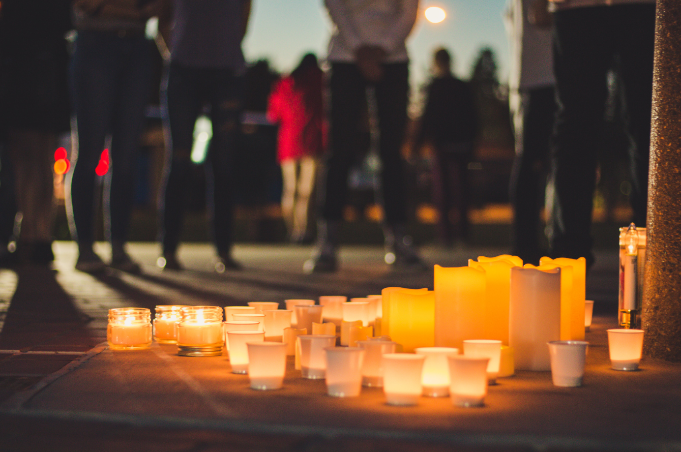 Citizens of Ventura, Ca. circle around the candle lit alter outside of the Government Center. Credit: Stefan Fahr / The Foothill Dragon Press