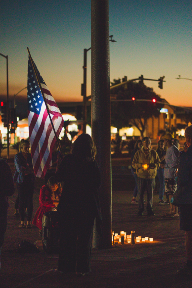 Aside from the candle lit vigil, Ventura residents brought a United States flag. Credit: Stefan Fahr / The Foothill Dragon Press