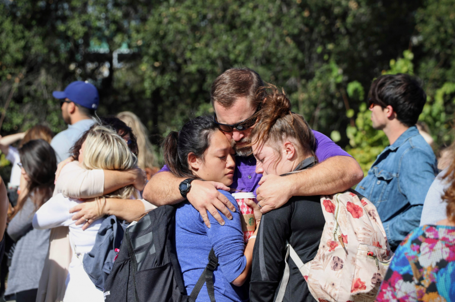 Cal Lutheran staff member hugs devastated students. Credit: Olivia Sanford / The Foothill Dragon Press