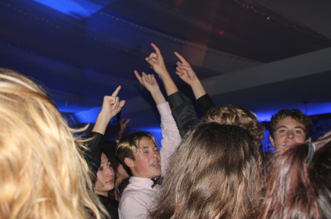 Students raise the roof for the DJ's final song. Credit: Maya Avelar / The Foothill Dragon Press