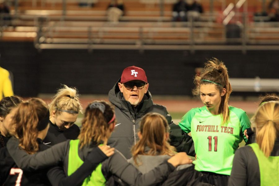 Head coach Jack Craig talks to the girls prior to the game. Credit: Ethan Crouch / The Foothill Dragon Press