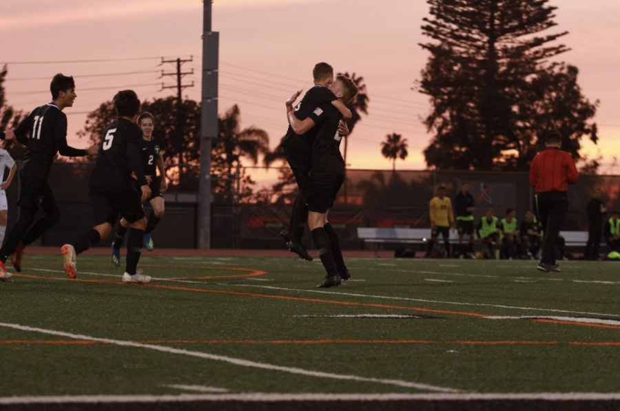 Dragons celebrate after scoring the first goal of the game. Credit: Jason Messner / The Foothill Dragon Press