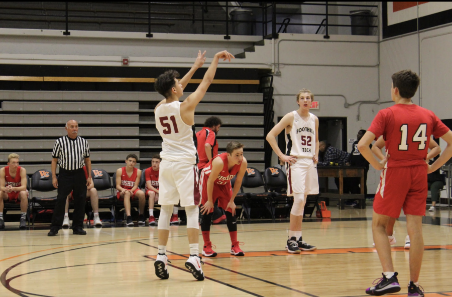 Justin Razo 21 holds his form after shooting a free throw. Credit: Abby Sourwine / The Foothill Dragon Press
