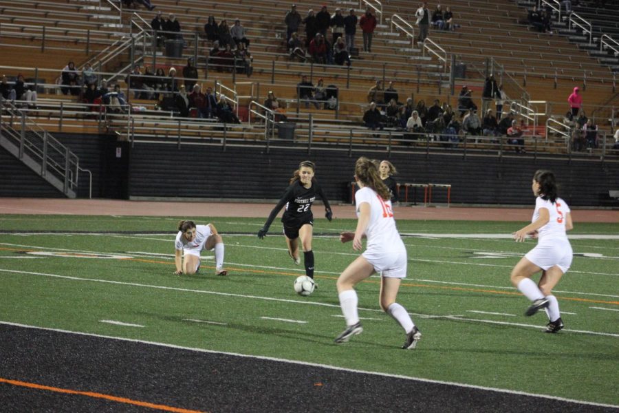 Grace Combs 20 enters the goal box and tries to score.