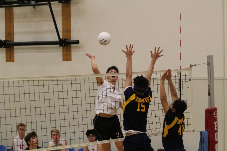 Stefan Fahr 19 leaps into the air to extend his arm and send the ball down to his opponents.