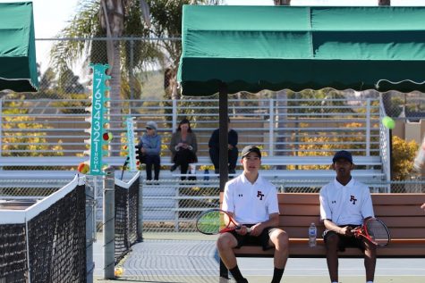 Tomas Carrillo 20 and Shiv Bhakta 20 wait for their match. 