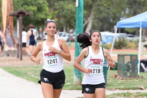 Gretchen Scherrei 20 and Hannah Dearman-So 21 pushing through to the end of the race