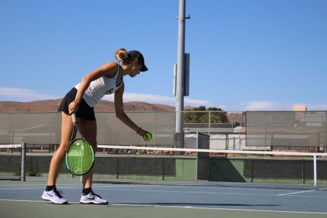 Noelle Hayward 21 getting ready to serve the ball