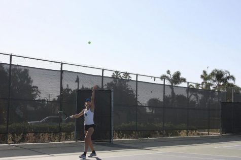 Noelle Hayward 21 serves the ball