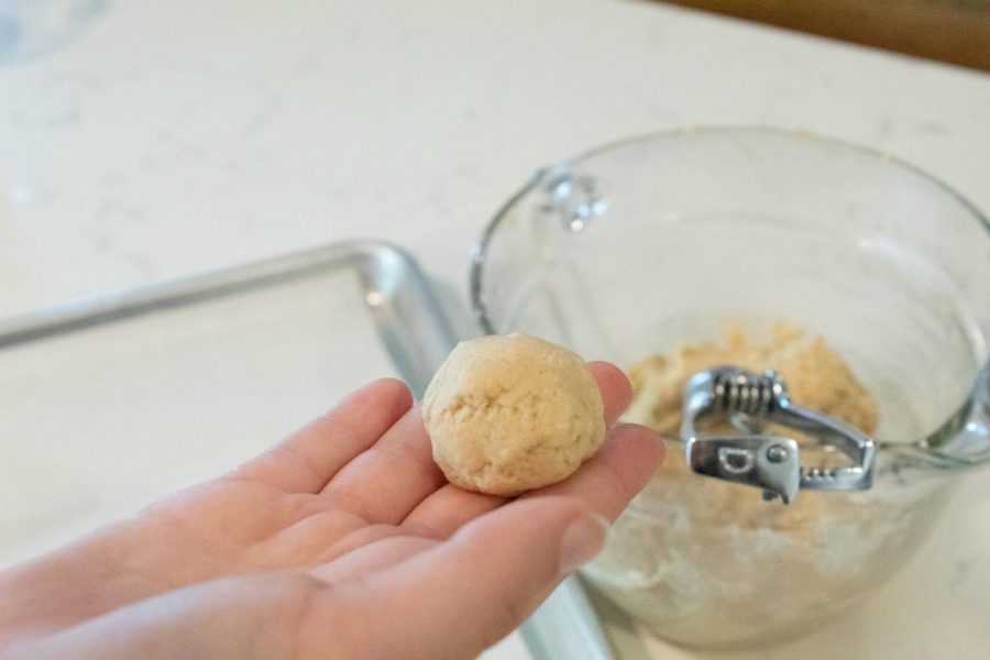 Use a 2-inch cooking scooper or your hands and roll dough into a ball