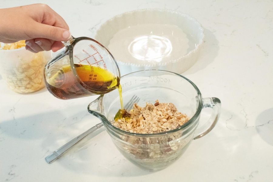 Mix ¼ cup of maple syrup and ¼ cup of olive oil into mixture until all covered