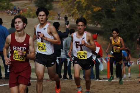 From the 2018 state finals, Jason Messner and Joshua Villasenor work up the hill at the two-mile marker.