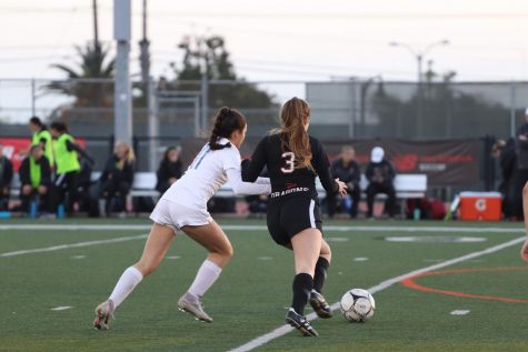 Elice DeLong 20 dribbles around the defender.