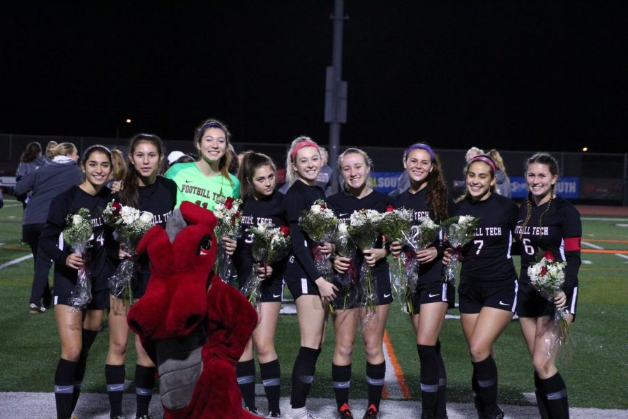 The senior girls pose on senior night, their last home game before CIF.